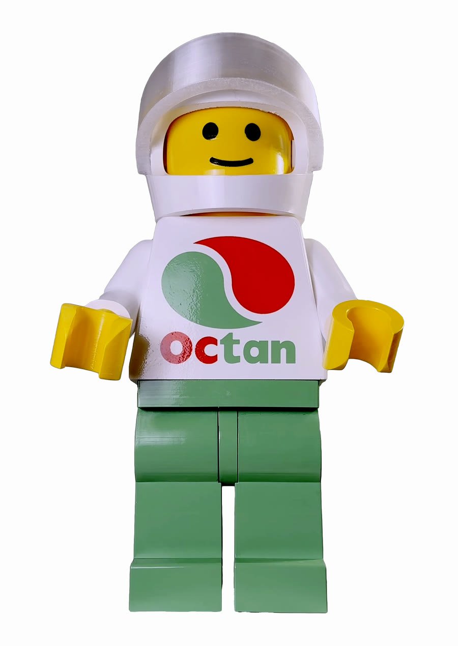 The same figure wearing the white open-face racing helmet, turned through a full revolution — the +$49 add-on