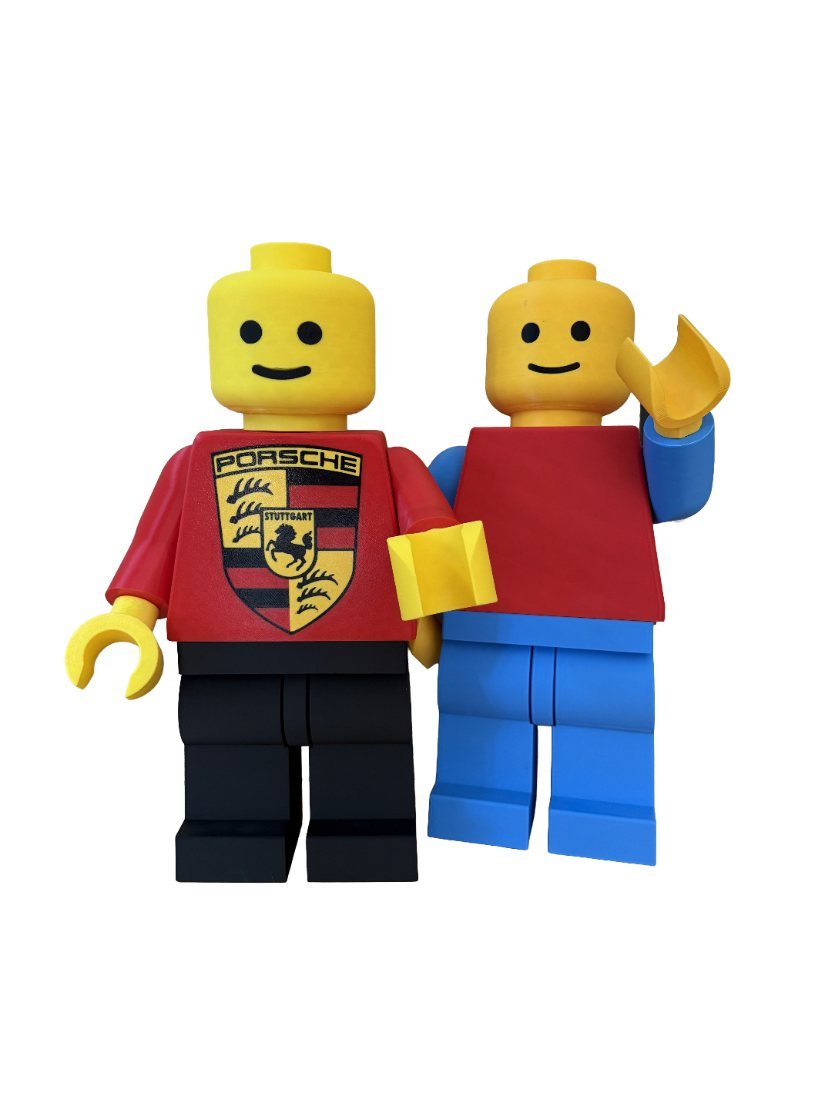 Two giant 3D printed Mega Figures posed mid-wave with a shared display base