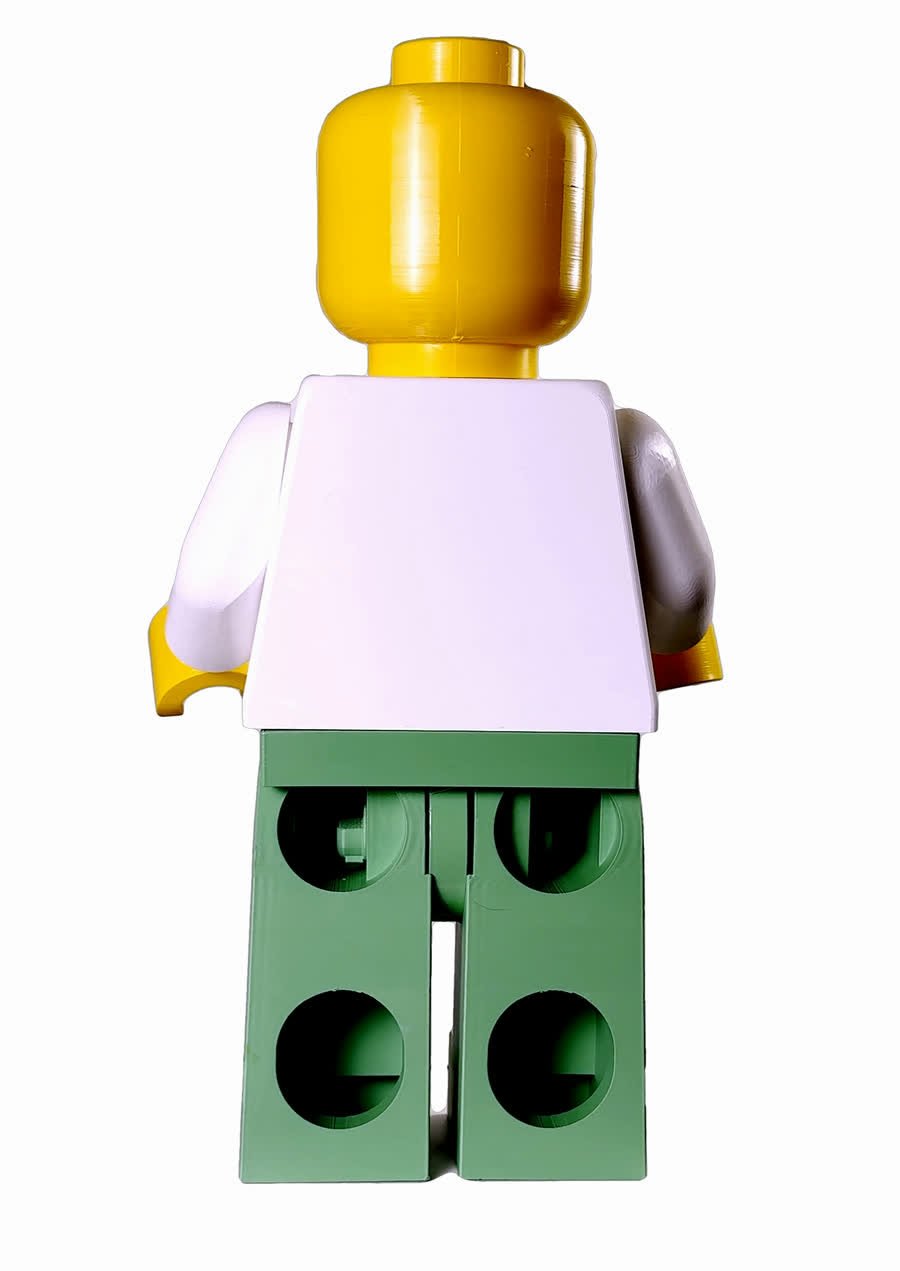 Rear view of the Octan Vintage Racer — a plain white torso back, sage green legs with the sockets showing, and the back of the yellow head