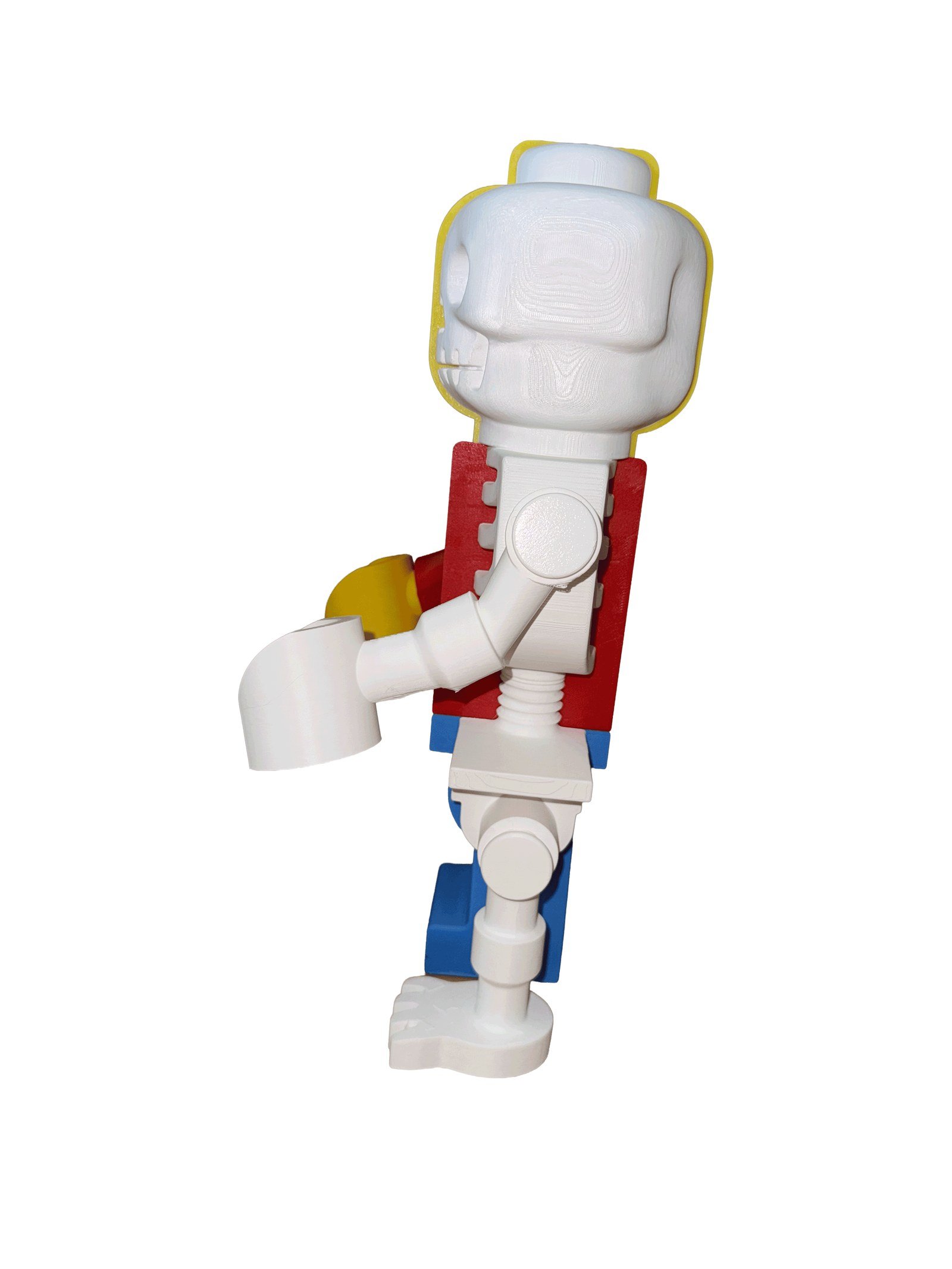 Left profile of the Skeleton Fig, showing the skeleton half: skull, spine, ribcage and bone arm over the red torso